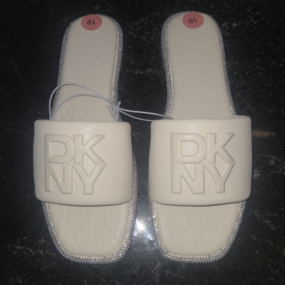 Dkny Shoes - DKNY White Slide Sandals with Embossed Logo and Rhinestone Trim